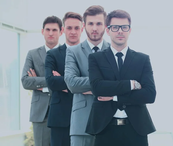 Business team in a line smiling at the camera — Stock Photo, Image