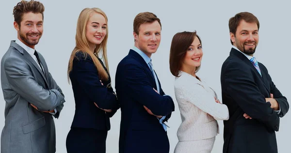 Lächelndes Business-Team, das aufrecht steht, die Hände auf dem Kopf — Stockfoto