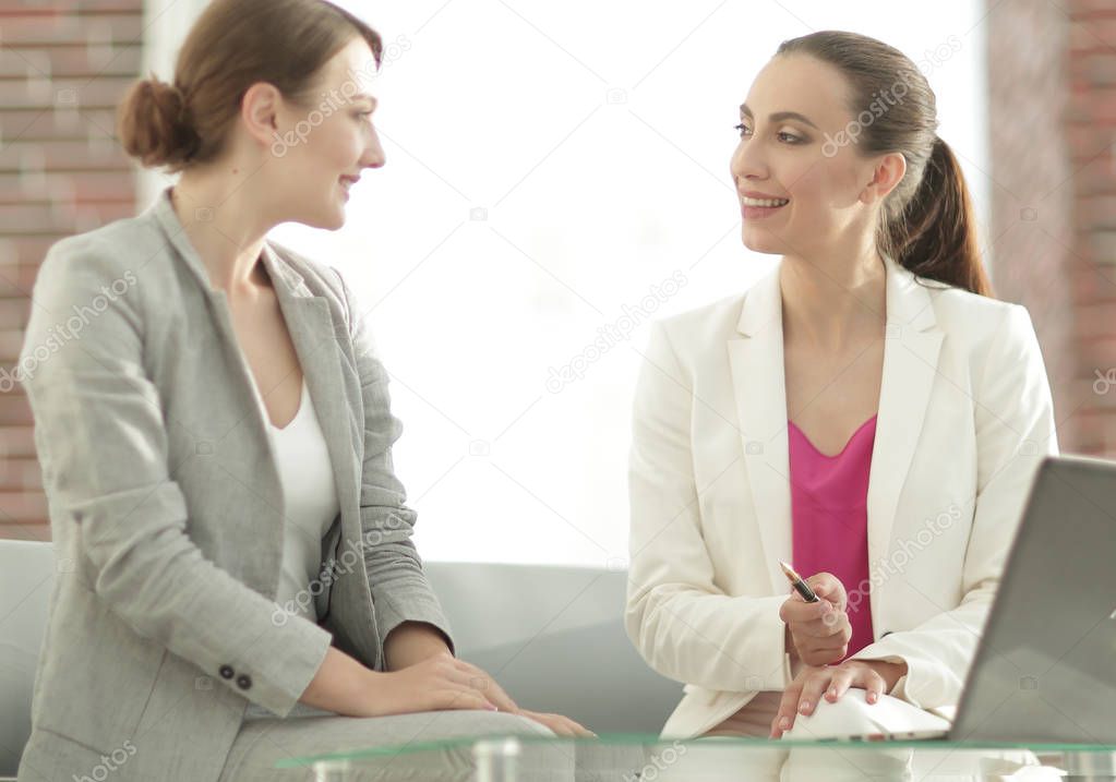 two business women discussing project cooperation
