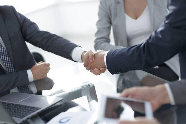 confident handshake of business partners