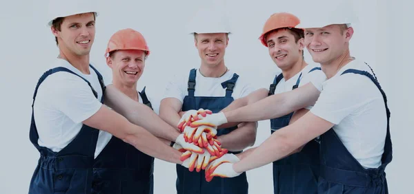 Equipe de construtores unindo as mãos em círculo — Fotografia de Stock
