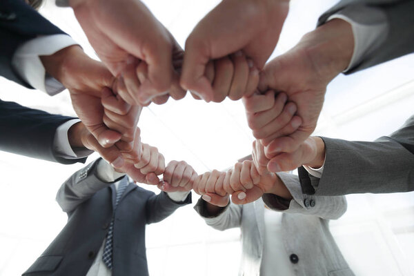 group of people joined their hands