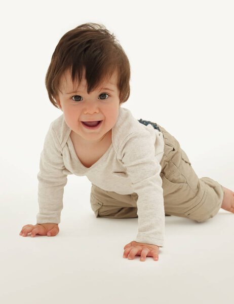 the baby learns to crawl isolated on white background