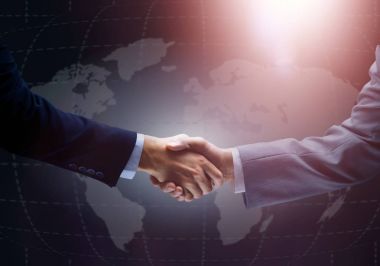 el sıkışma ile arka planda Dünya Haritası