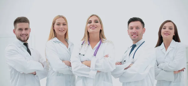 Confident doctors posing and smiling at camera — Stock Photo, Image