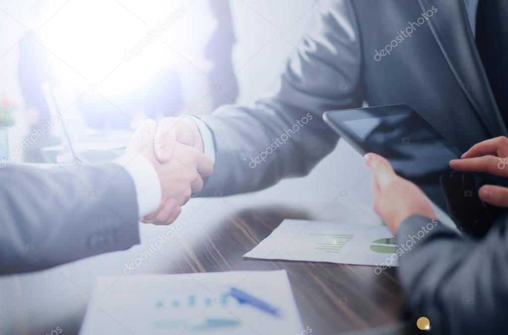 concept - benefits from successful cooperation. the handshake bu