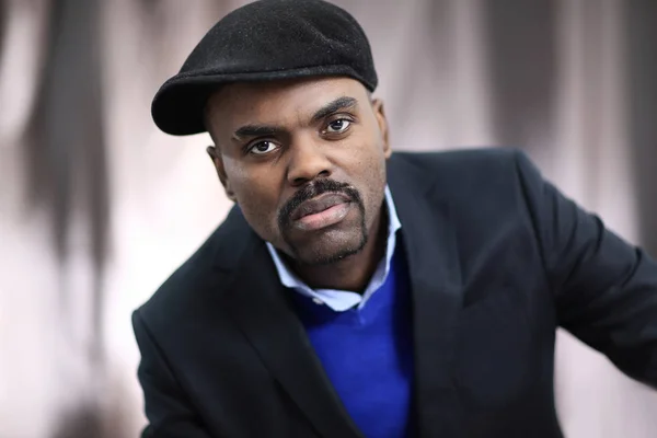 African American man posing with hand on his chin — Stock Photo, Image