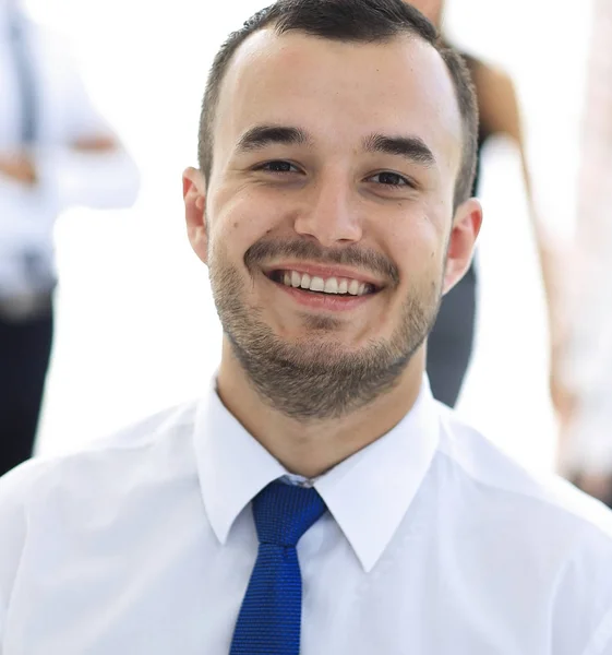 portrait of successful businessman on blurred background