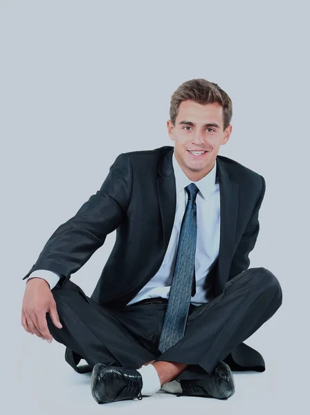 Hombre de negocios sentado aislado sobre un fondo blanco . — Foto de Stock