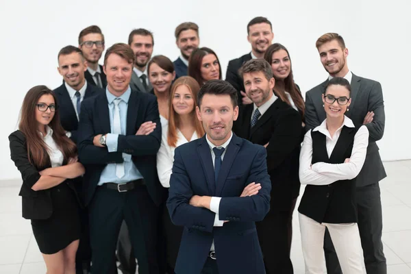 Leader standing in front of a large business team — Stock Photo, Image