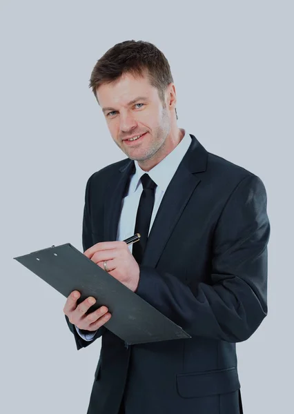 Hombre de negocios escribiendo en portapapeles llevar traje elegante y corbata . —  Fotos de Stock