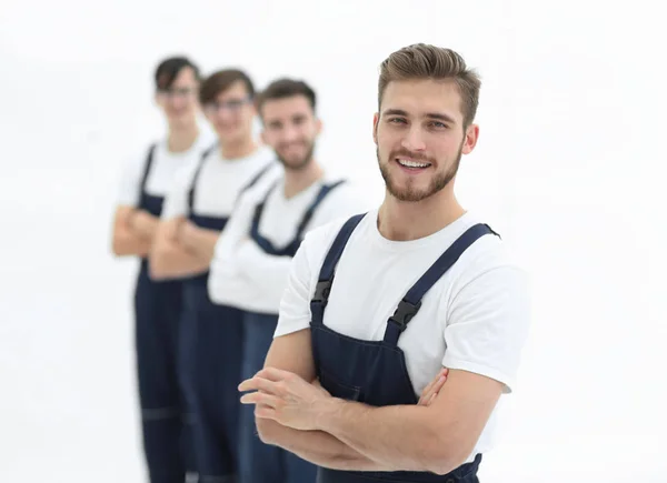 Équipe joyeuse de déménageurs responsables isolés sur fond blanc — Photo