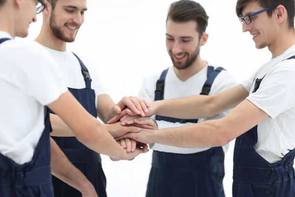 Close up vista superior de jovens movers colocando as mãos juntas . — Fotografia de Stock