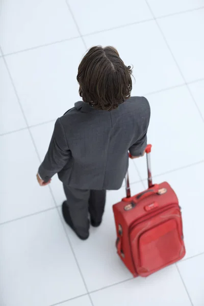 Uomo d'affari con bagaglio .isolato su bianco . — Foto Stock