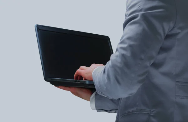 Handsome businessman holding a laptop — Stock Photo, Image