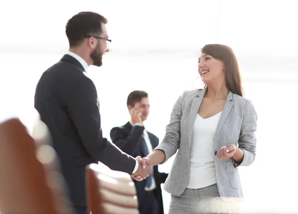 Handshake between colleagues in the workplace — Stock Photo, Image