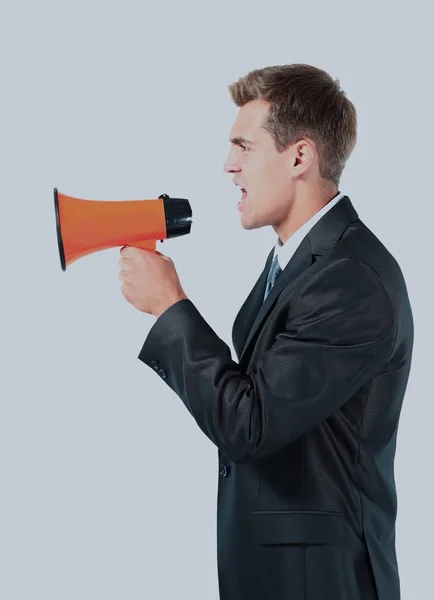 Business man screaming loudly in a megaphone. — Stock Photo, Image
