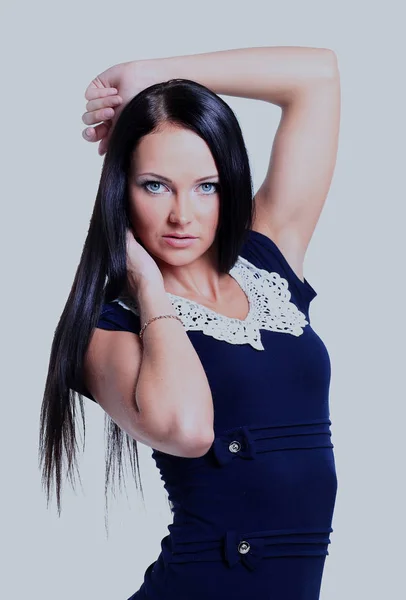 Young brunette lady in blue dress posing on white background — Stock Photo, Image