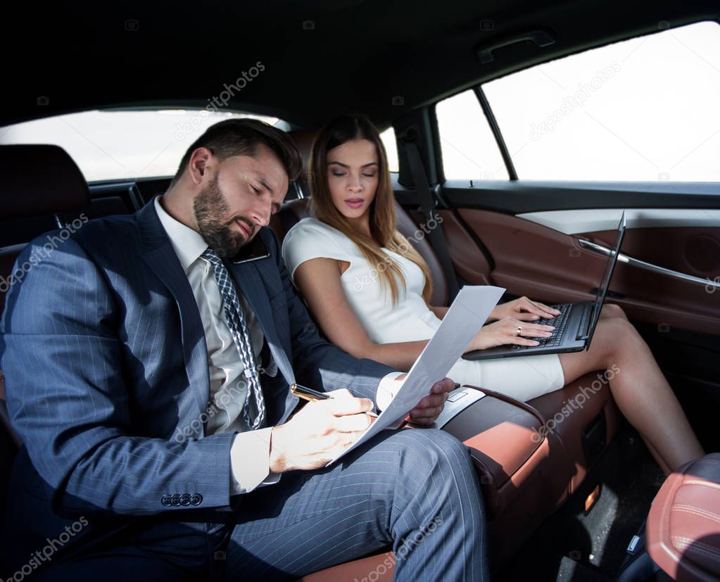 Business trip- Talking on mobile to work of car