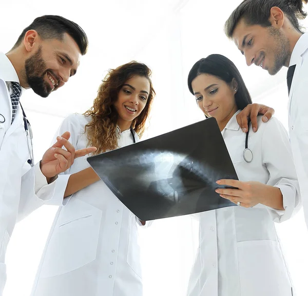 group of doctors discussing an x-ray