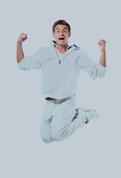 Springen jonge man. geïsoleerd op witte achtergrond. — Stockfoto