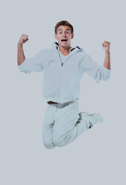 Jumping young man. Isolated over white background.