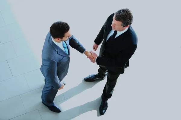 Top view of a two businessman shaking hands - Welcome to business. — Stock Photo, Image