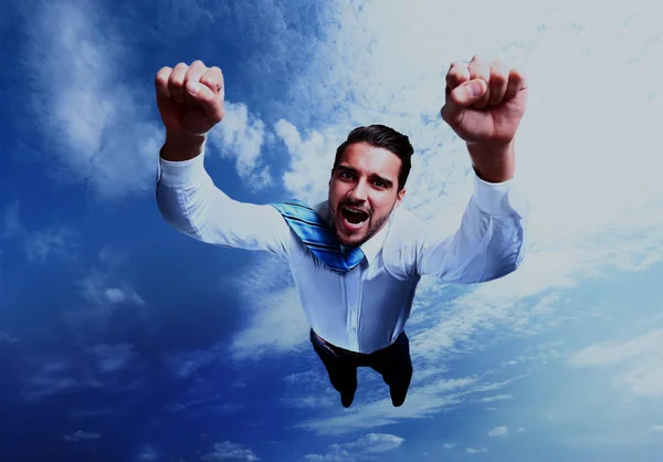 Happy businessman flying in the sky.