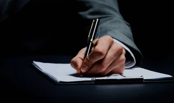 Businessmans hand with pen. — Stock Photo, Image