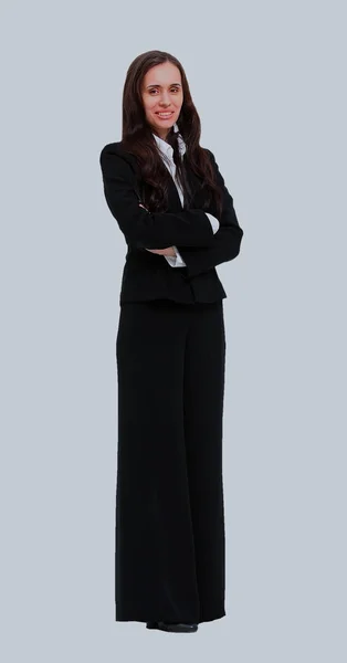 Retrato de comprimento total de uma bela mulher de negócios de pé com as mãos dobradas sobre fundo branco . — Fotografia de Stock