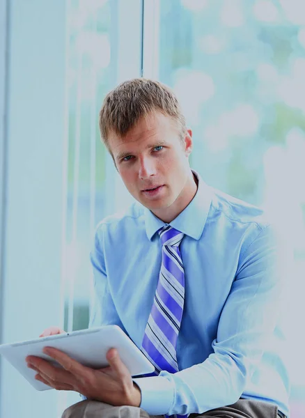 Portrait of a businessman working on his tablet. Royalty Free Stock Images