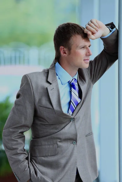 Portrait of a businessman looking at the window. — Stock Photo, Image
