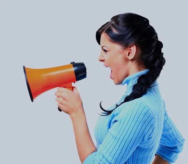 Young woman speaking through megaphone. — Stock Photo, Image