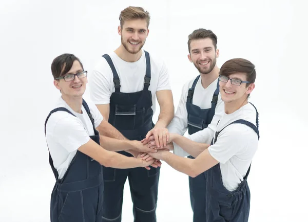 Team of movers joining hands. — Stock Photo, Image