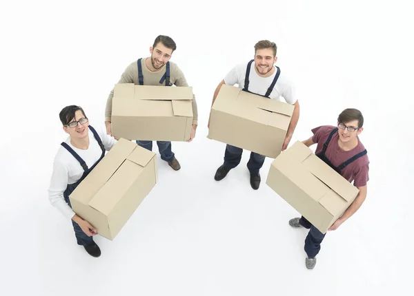 Jovens móveis segurando caixas isoladas no fundo branco , — Fotografia de Stock