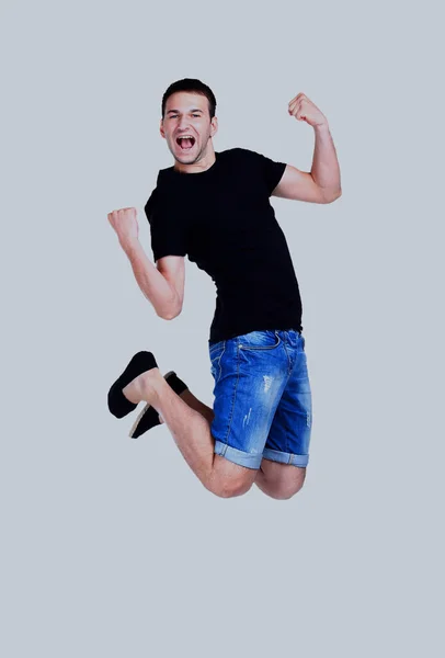 Jonge lachende man springen. — Stockfoto