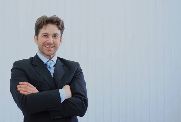 Portrait of happy young businessman at office. — Stock Photo, Image