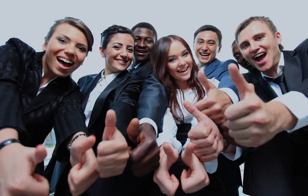 Successful business people with thumbs up and smiling — Stock Photo, Image