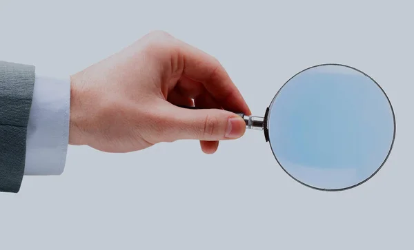 Magnifying glass in hand isolated over white background. — Stock Photo, Image