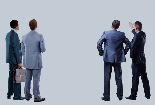 Four business mans from the back - looking at something over a white background. — Stock Photo, Image