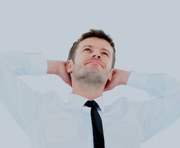 Portrait of handsome business man relaxing with hands behind head. — Stock Photo, Image
