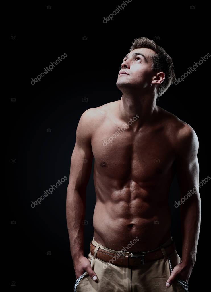 Young Bodybuilder Man On Black Background Stock Image 