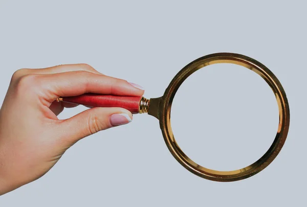 Magnifying glass in hand isolated on white background. — Stock Photo, Image