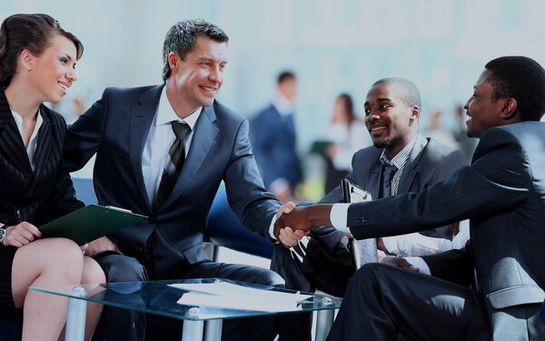 Business people shaking hands, finishing up a meeting.