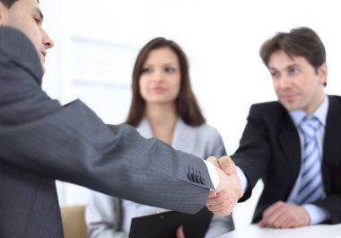 handshake business partners in the workplace clipart