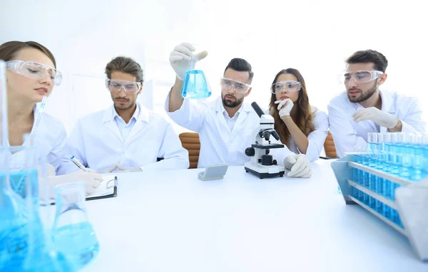Team of scientists working together at the laboratory