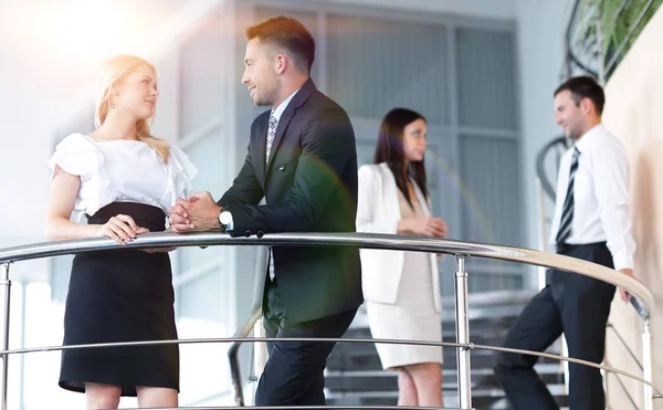Employees communicate standing on the terrace of the office. — Stock Photo, Image