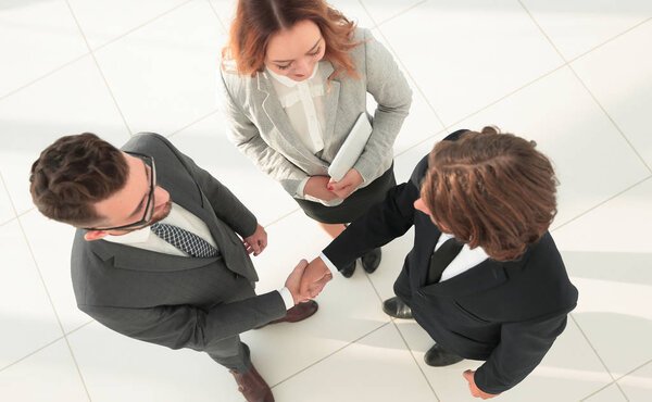 Business men shaking hands making an agreement