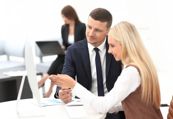 Manager talking with a colleague at the workplace Stock Image