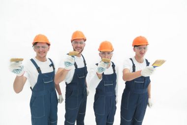 En baştan görüntüleyin. inşaatçılar .isolated beyaz bir grup